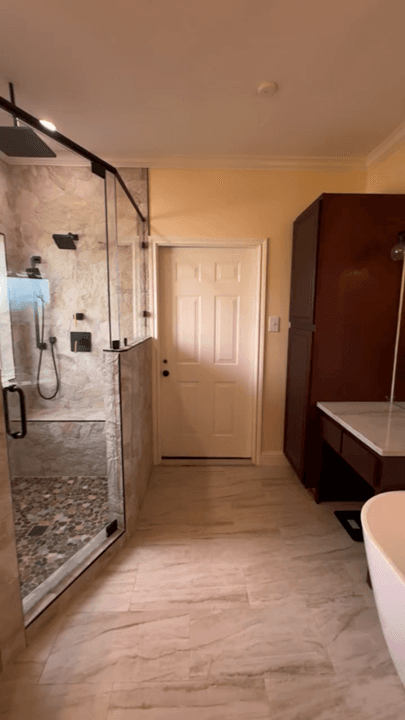 Custom shower and bath remodel with glass shower, tile, and updated flooring